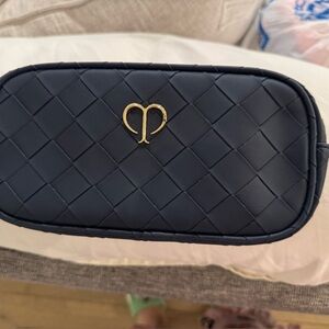 New quilted navy blue cle de peau makeup bag